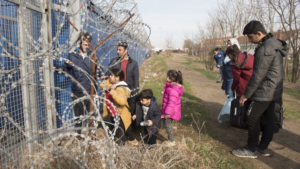 SUBOTICA, SERBIA  MARCH 23 : A Syrian family waits next to the border gate, after they were selected to claim asylum in Hungary at  the Kelebija border crossing , Subotica, Serbia on March 23,2017. Omar Marques / Anadolu Agency