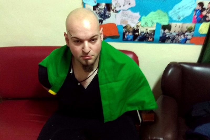 This handout picture released by the Italian Carabinieri Press Office on February 3, 2018 shows Italian national Luca Traini arrested for suspected of wounding several foreign nationals in a drive-by shooting in Macerata. Italian police have arrested a far-right supporter suspected of wounding several foreigners in a drive-by shooting on February 3, in what local media called a racially motivated attack. After the assault in the central town of Macerata, the suspect got out of his car and made a fascist salute with a tricolour Italian flag draped over his shoulders, Italian media reported. / AFP PHOTO / ITALIAN CARABINIERI PRESS OFFICE / HO / RESTRICTED TO EDITORIAL USE - MANDATORY CREDIT "AFP PHOTO /ITALIAN CARABINIERI PRESS OFFICE" - NO MARKETING NO ADVERTISING CAMPAIGNS - DISTRIBUTED AS A SERVICE TO CLIENTS