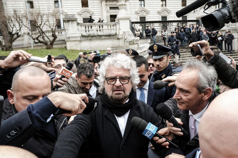 Five Star Movement (M5S) founder Beppe Grillo (C) leaves the Interior Ministry on January 19, 2018 after the registration of the logo for the upcoming general elections to be held on March 4, 2018. / AFP PHOTO / ANDREAS SOLARO