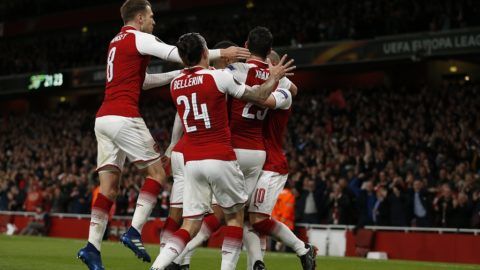 Arsenal's French striker Alexandre Lacazette celebrates with teammates after scoring the opening goal of the UEFA Europa League first leg semi-final football match  between Arsenal and Atletico Madrid at the Emirates Stadium in London on April 26, 2018.  / AFP PHOTO / IKIMAGES / Ian KINGTON