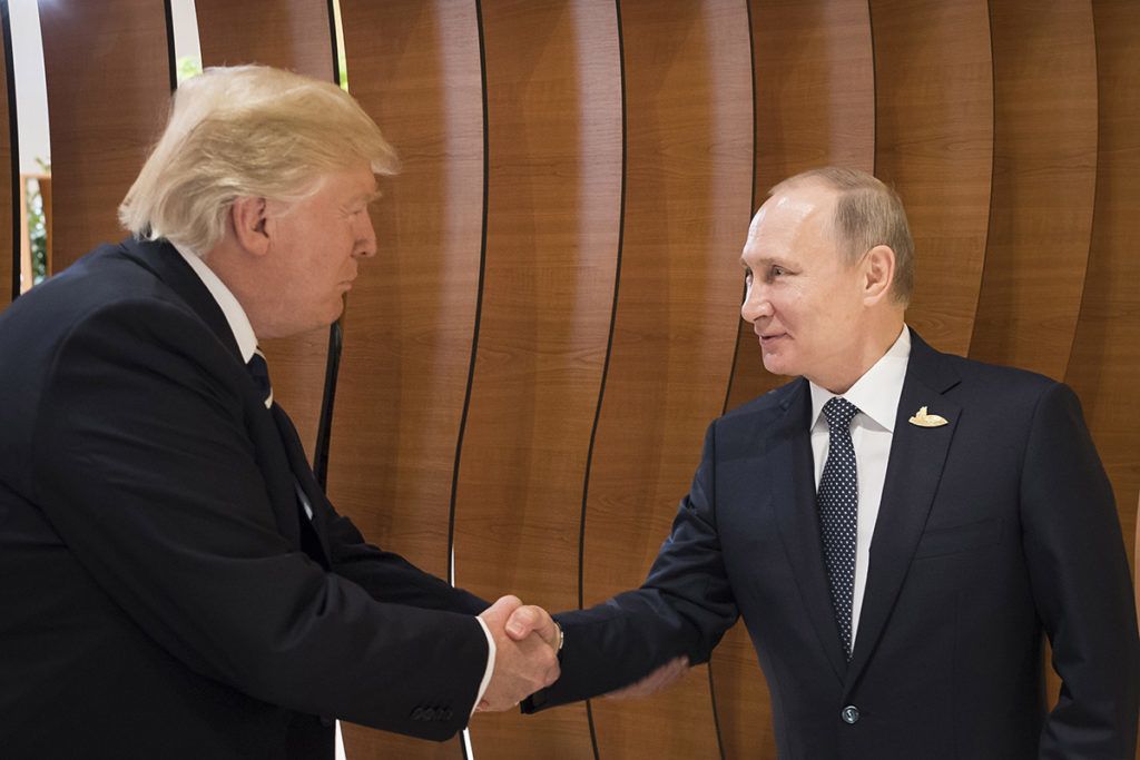 HAMBURG, GERMANY - JULY 07: In this photo provided by the German Government Press Office (BPA) Donald Trump, President of the USA (left), meets Vladimir Putin, President of Russia (right), at the opening of the G20 summit on July 7, 2017 in Hamburg, Germany. The G20 group of nations are meeting July 7-8 and major topics will include climate change and migration.  (Photo by Steffen Kugler /BPA via Getty Images)