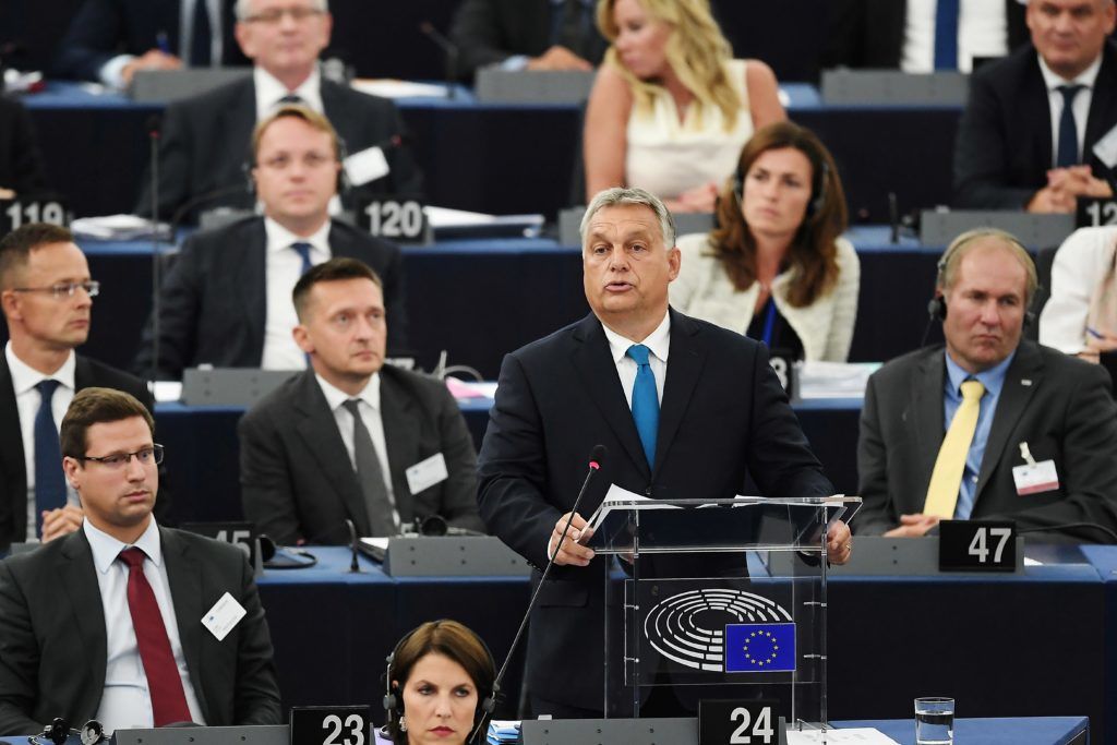 Hungary's Prime Minister Viktor Orban delivers a speech during a debate concerning Hungary's situation as part of a plenary session at the European Parliament on September 11, 2018 in Strasbourg, eastern France. Hungarian Prime Minister Viktor Orban vowed, pn September 11, 2018, to defy EU pressure to soften his hardline anti-migrant stance, condemning what he called the "blackmail" of his country. / AFP PHOTO / FREDERICK FLORIN