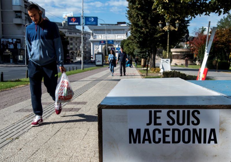 A man walks by a sign that reads in French: "I am Macedonian" written by supporters of the "No" in the upcoming referendum on whether to change the country's name to "Republic of Northern Macedonia".
Voters across the Balkan state of Macedonia will decide on September 30, 2018 whether to re-name their country North Macedonia, an emotional vote that could end a bitter row with Greece and unlock a path to NATO and the EU. It is a loaded question for many in the nation of around 2.1 million, which has tussled with Greece for 27 years over its name and history. / AFP PHOTO / Robert ATANASOVSKI