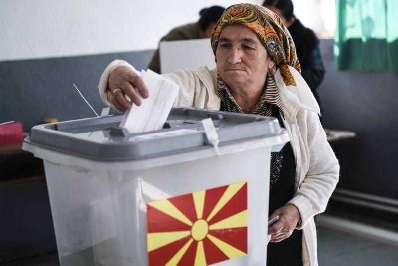 An Albanian woman casts her vote at a polling station in the village of Zajas on September 30, 2018, for a referendum to re-name the country.
Macedonians cast ballots on September 30 on whether to re-name their country North Macedonia, a bid to settle a long-running row with Greece and unlock a path to NATO and EU membership. / AFP PHOTO / Armend NIMANI