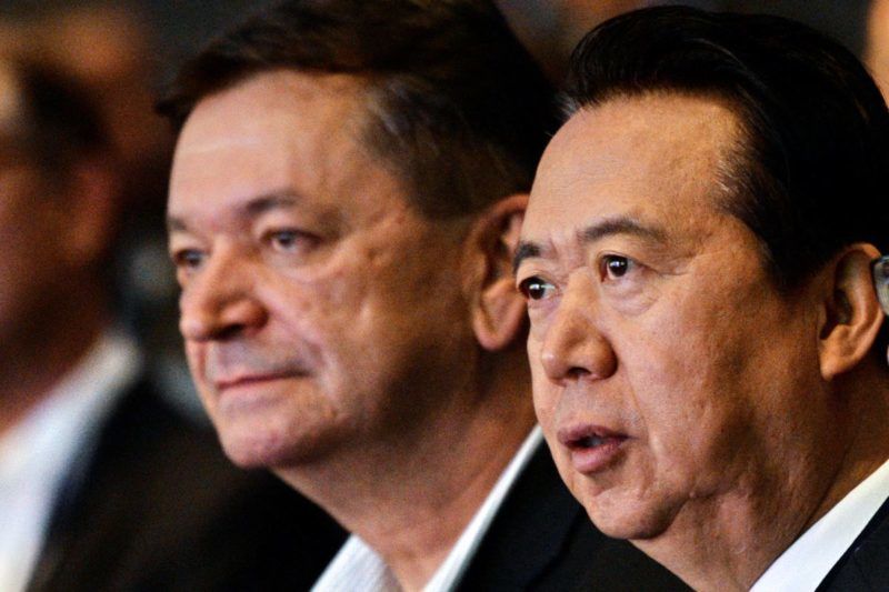 (FILES) In this file photo taken on July 04, 2017 Interpol vice president Alexander Prokopchuk (L) and and Meng Hongwei, president of Interpol, attend the opening of the Interpol World Congress in Singapore on July 4, 2017. - The Kremlin on November 20, 2018 denounced "interference" in the election for a new Interpol president after critics including US senators objected to a Russian becoming chief of the global police body. (Photo by ROSLAN RAHMAN / AFP)